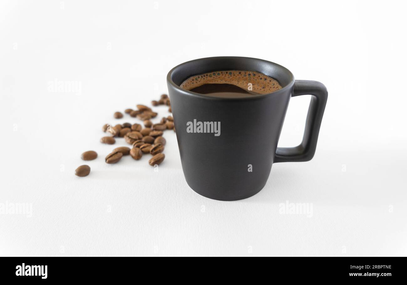 Coffee cup and coffee beans isolated on white background Stock Photo ...
