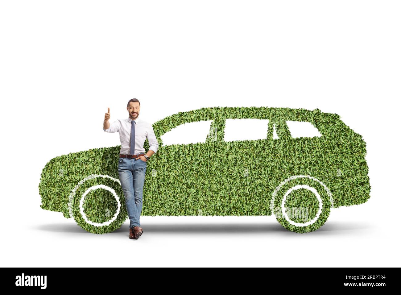 Full length portrait of a man leaning on a green car made of grass and gesturing thumbs up isolated on white background Stock Photo