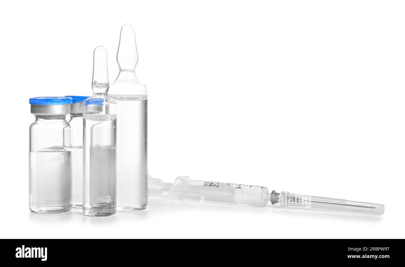 Medical ampules with syringe on white background Stock Photo Alamy