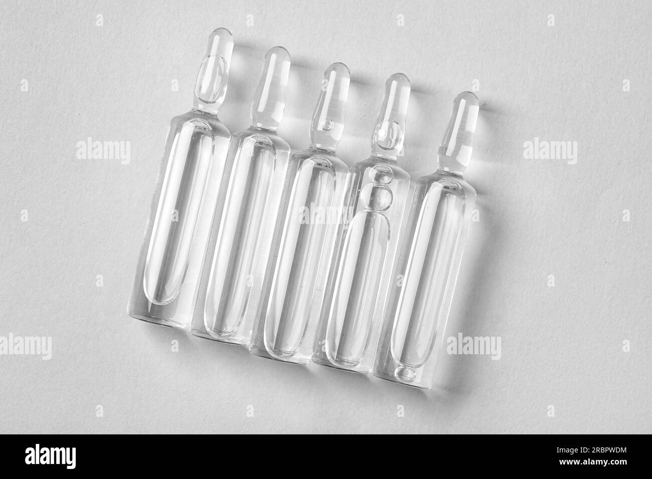 Medical ampules on light background Stock Photo Alamy
