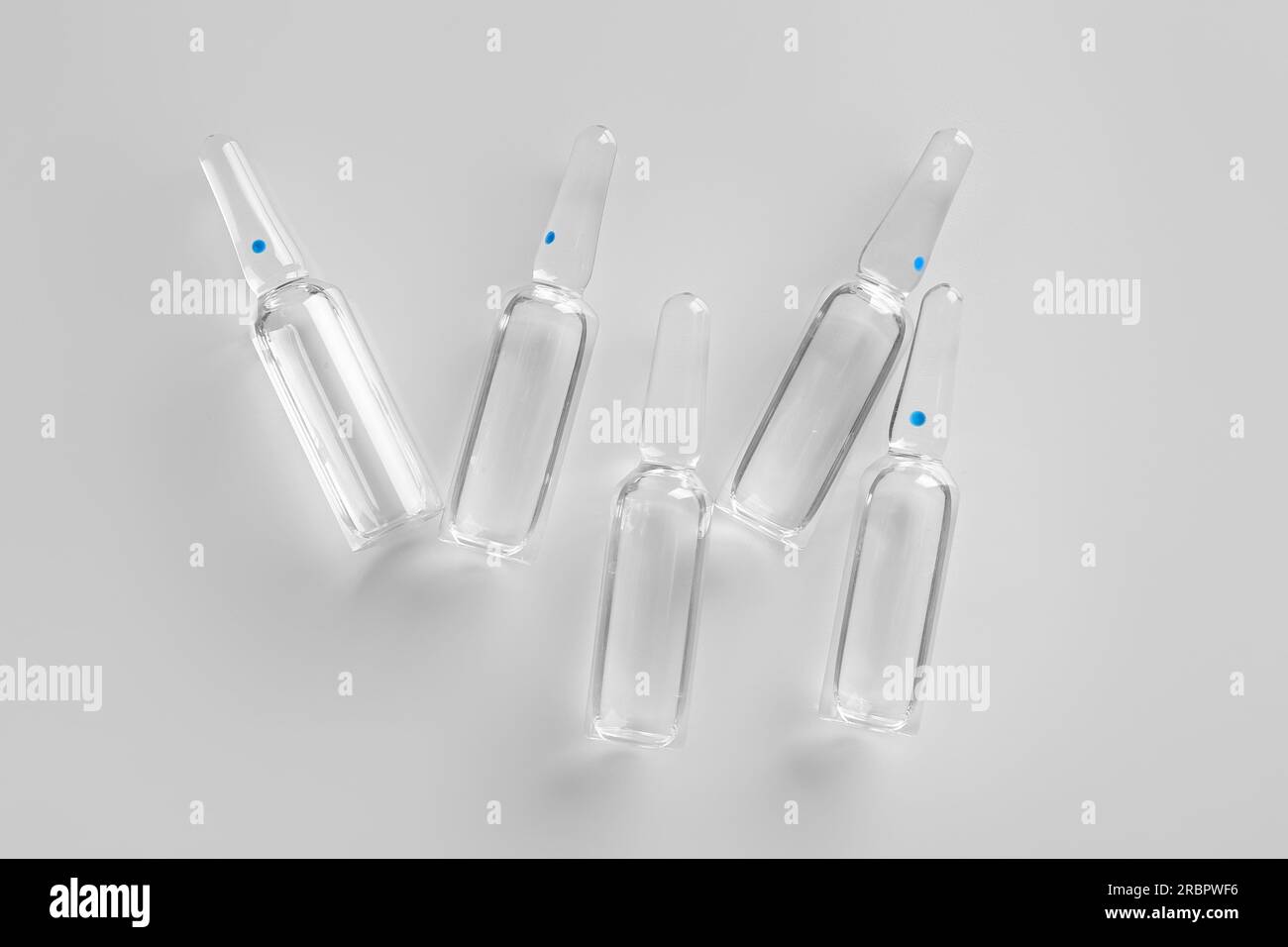 Medical ampules on light background Stock Photo Alamy