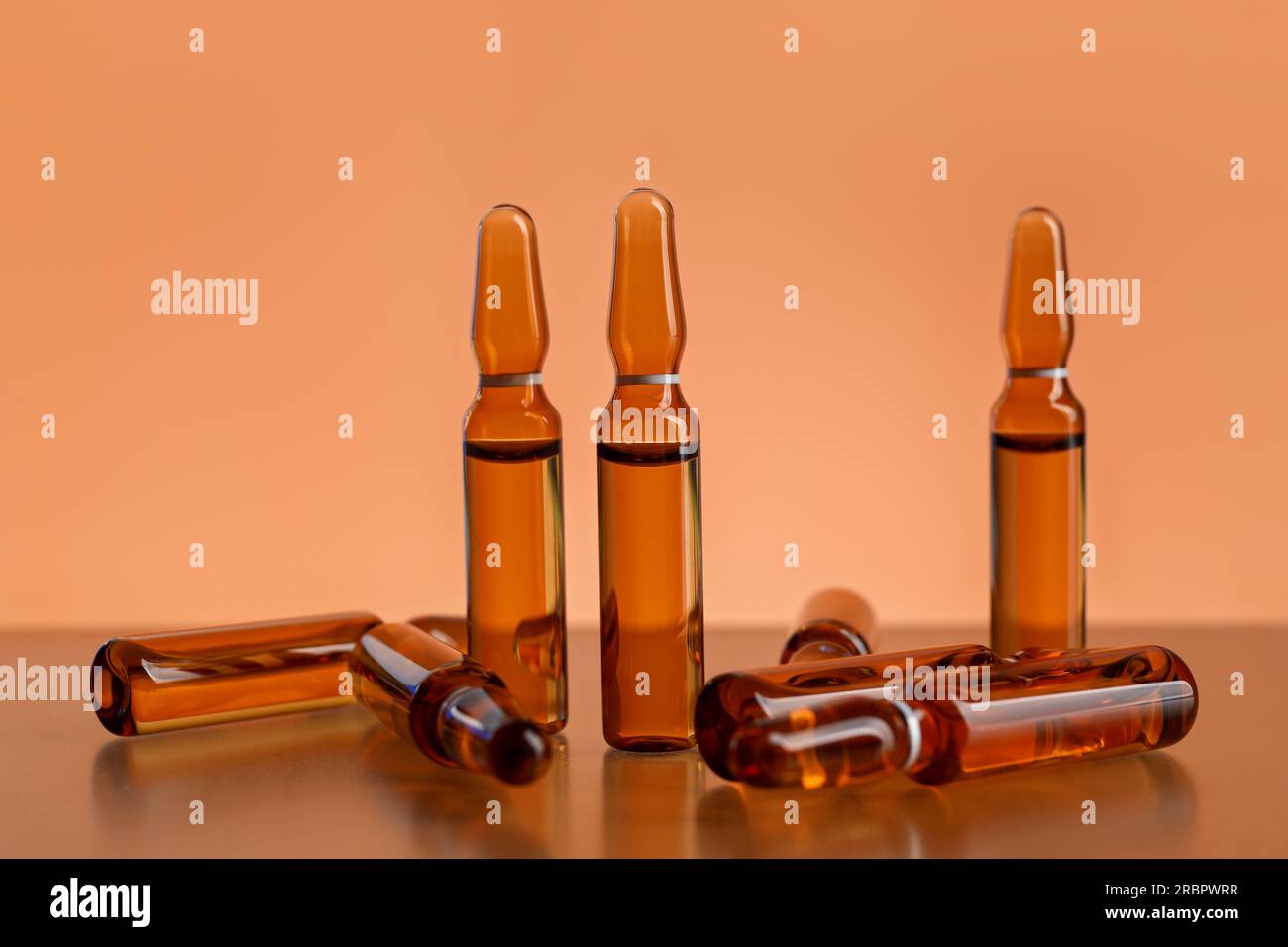 Medical ampules on orange background Stock Photo Alamy