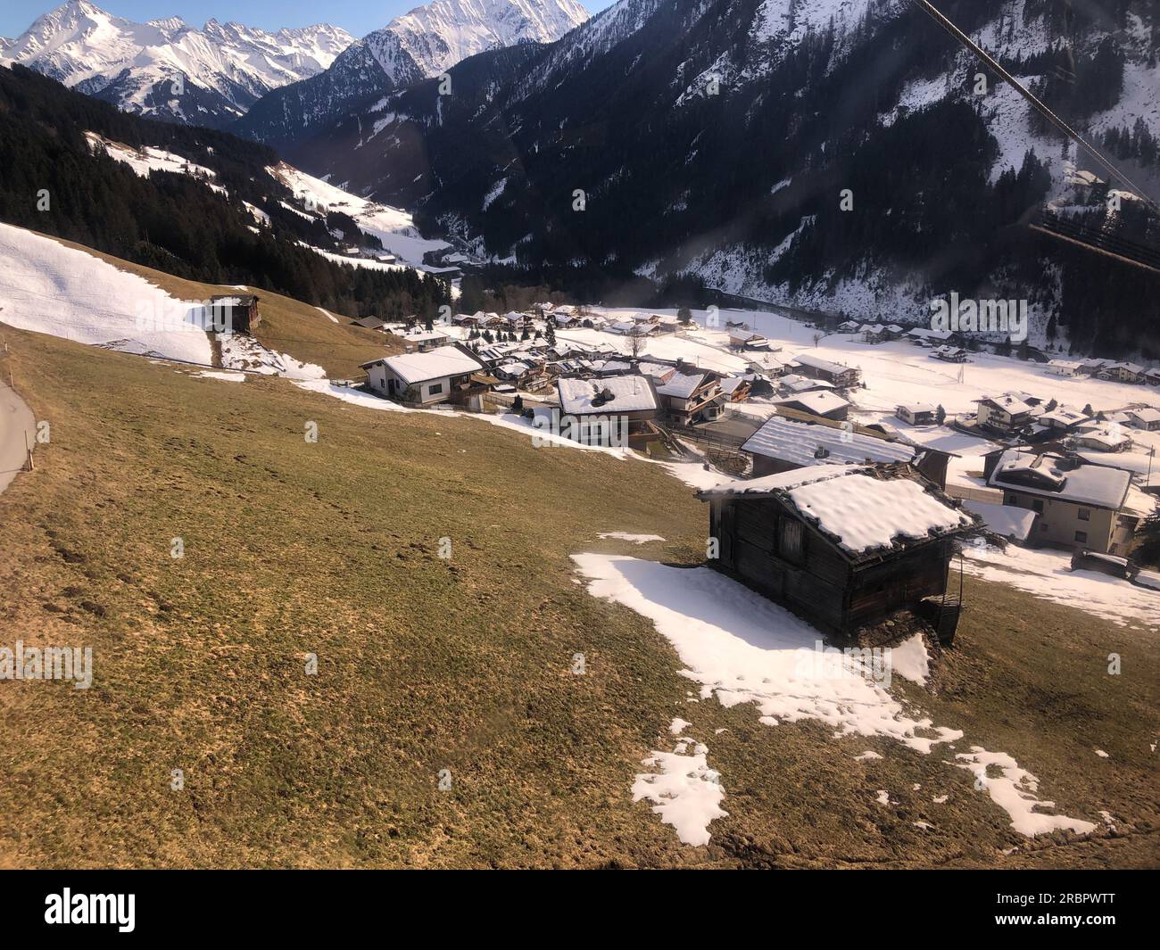 Snow melting in Austrian ski resort Stock Photo