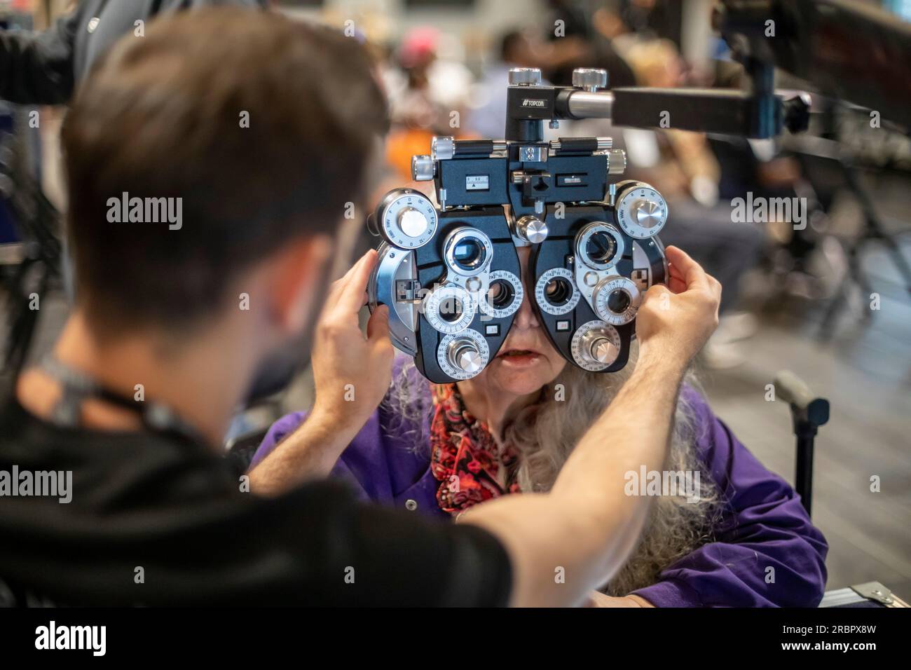 Detroit, Michigan - The OneSight Foundation organized a free clinic that offered eye exams and prescription glasses for low-income residents. OneSight Stock Photo