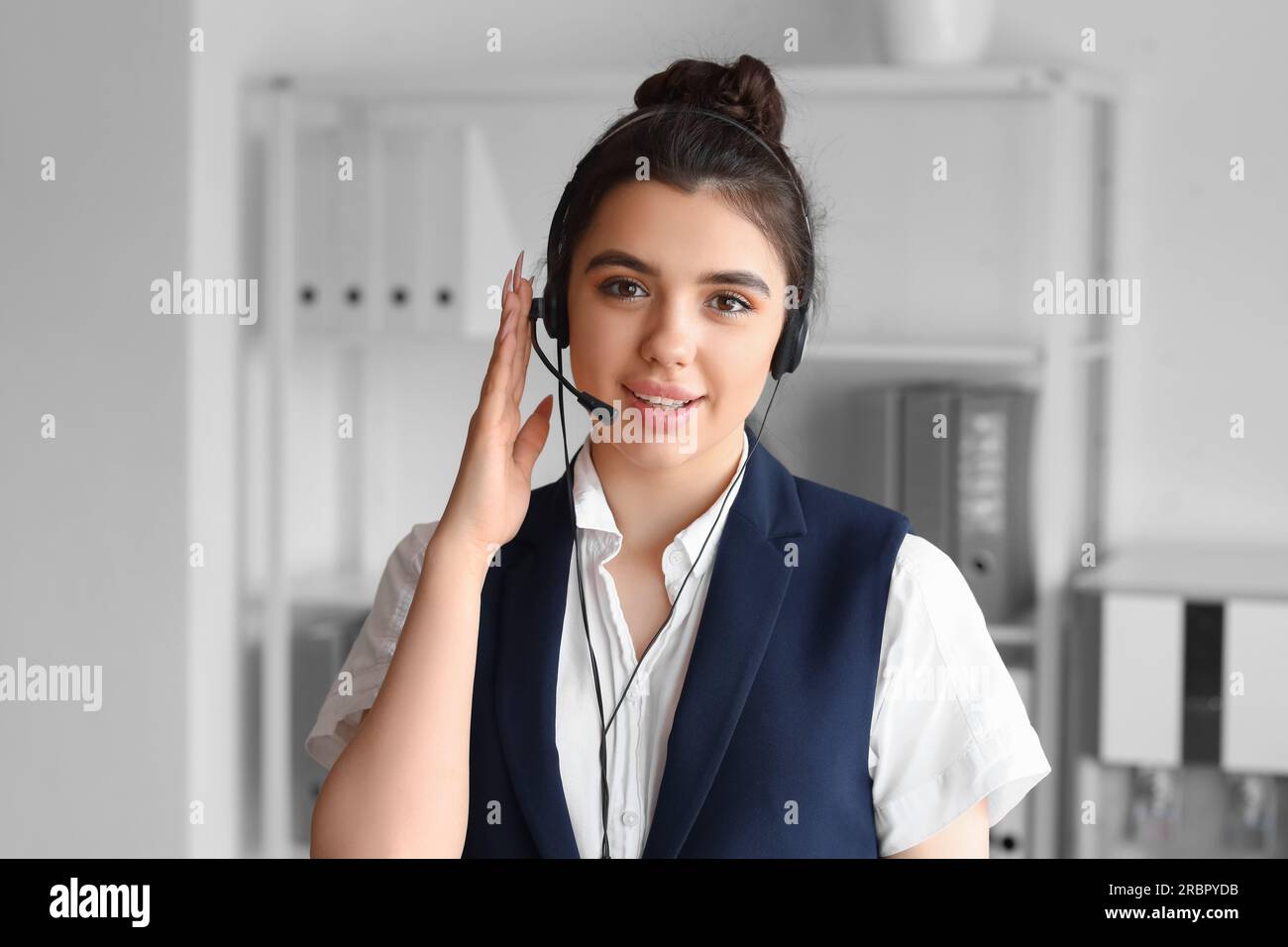 Female technical support agent in office Stock Photo - Alamy
