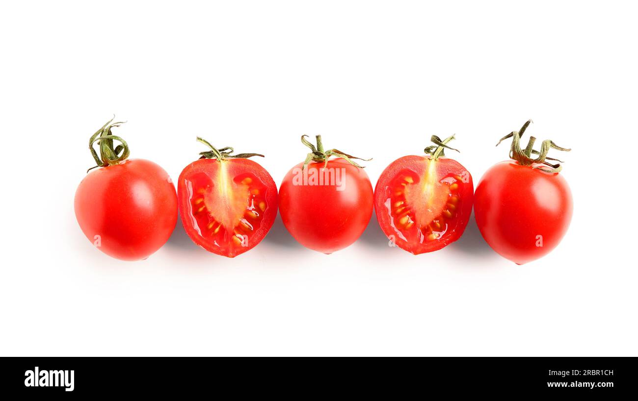Fresh cherry tomatoes with halves on white background Stock Photo - Alamy