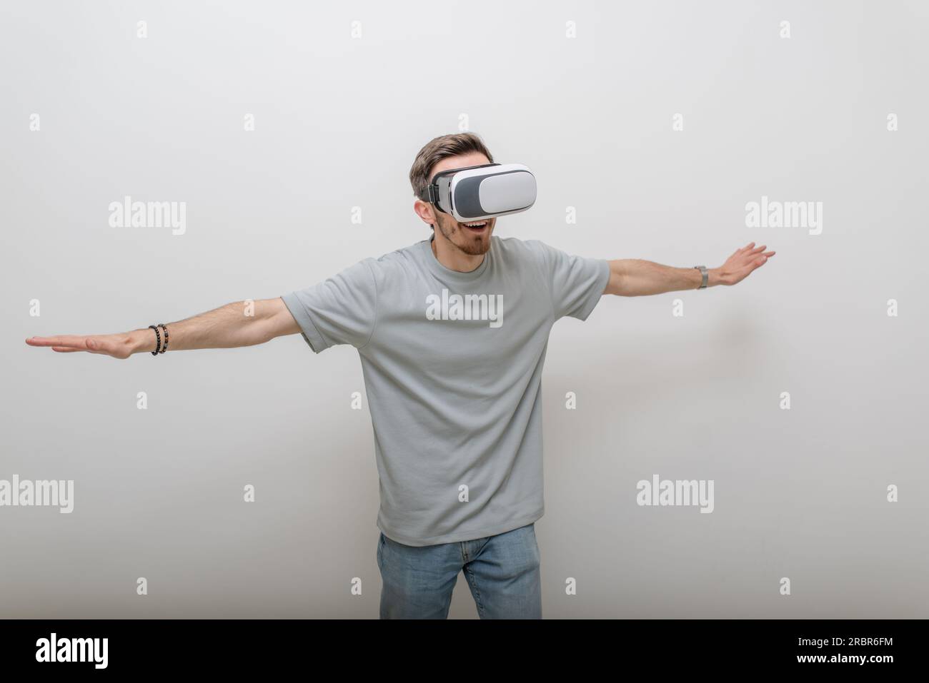 Futuristic man wearing virtual reality glasses interacts with the air ...