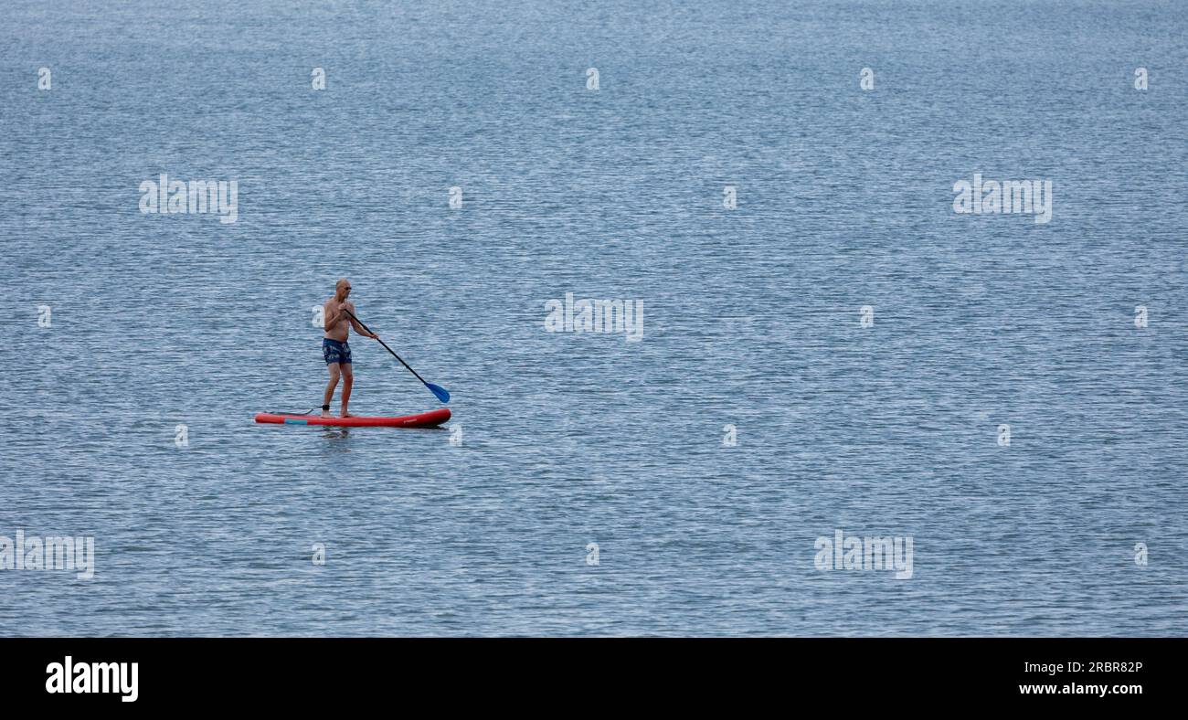 Barmouth ,wales, 14 june 2023 Stand up paddle board man paddleboarding