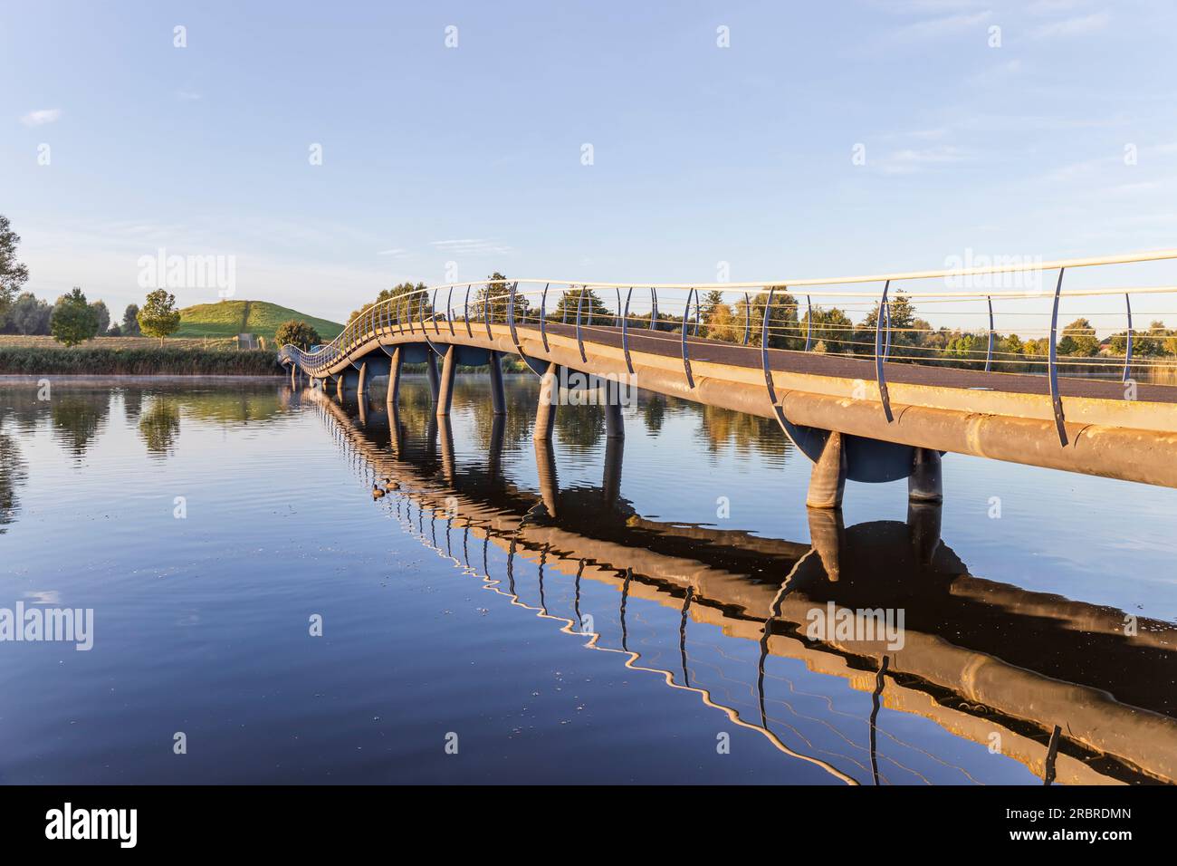 Barendrecht, the Netherlands - 2021-09-21: Bridge over Gaatkensplas in Barendrecht, the Netherlands, with a reflection in the water Stock Photo