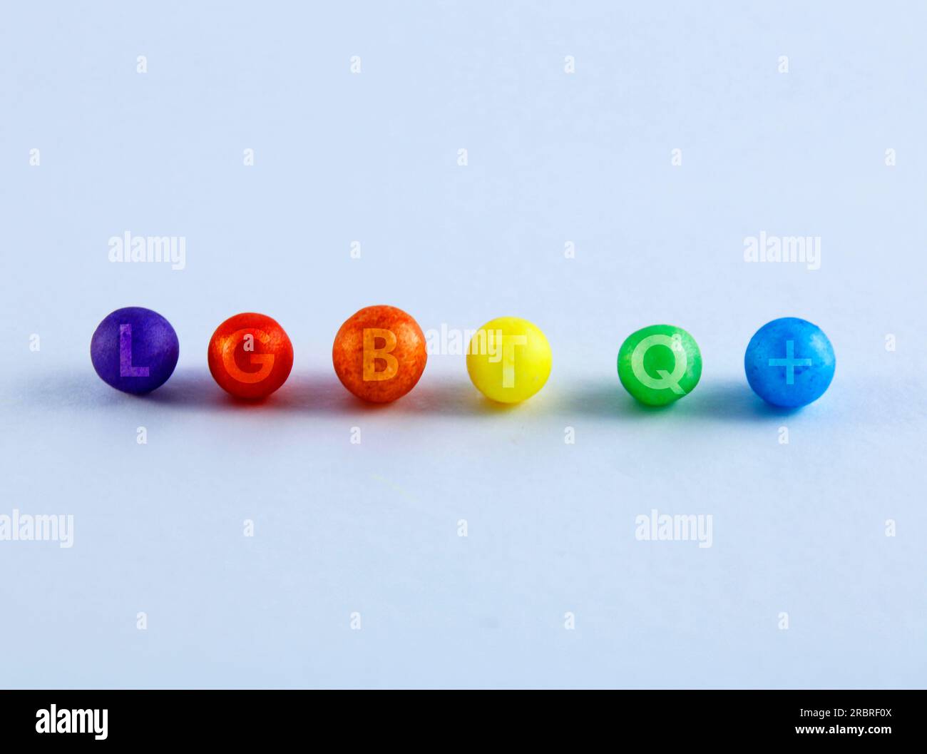 LGBTQ initials on spheres of different colors Stock Photo - Alamy