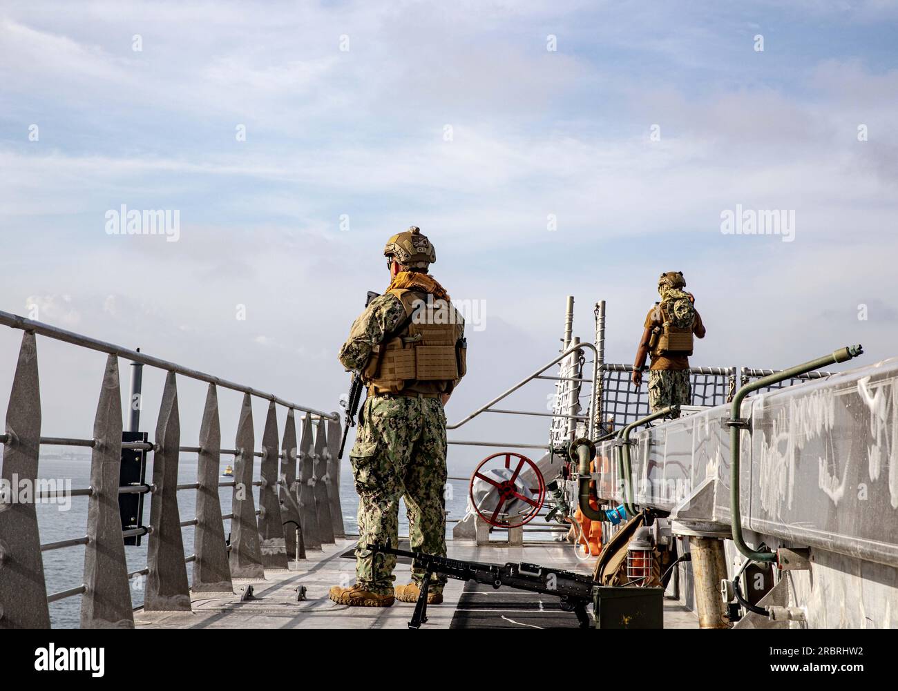20230701-N-EA686-1011  CARTAGENA, Colombia (July 1, 2023) Master-at-Arms 2nd Class Michael Turner, assigned to the expeditionary fast transport USNS Burlington (T-EFP 10), stands security forces watch as the ship arrives in Cartagena, Colombia in preparation for UNITAS LXIV, July 1, 2023. Burlington is one of 26 vessels slated to participate in UNITAS LXIV, the world’s longest running maritime exercise, July 11-21. Colombia is hosting UNITAS LXIV this year with nearly 7,000 people from 20 nations. (U.S. Navy photo by Lt.j.g. Nicko West/Released) Stock Photo