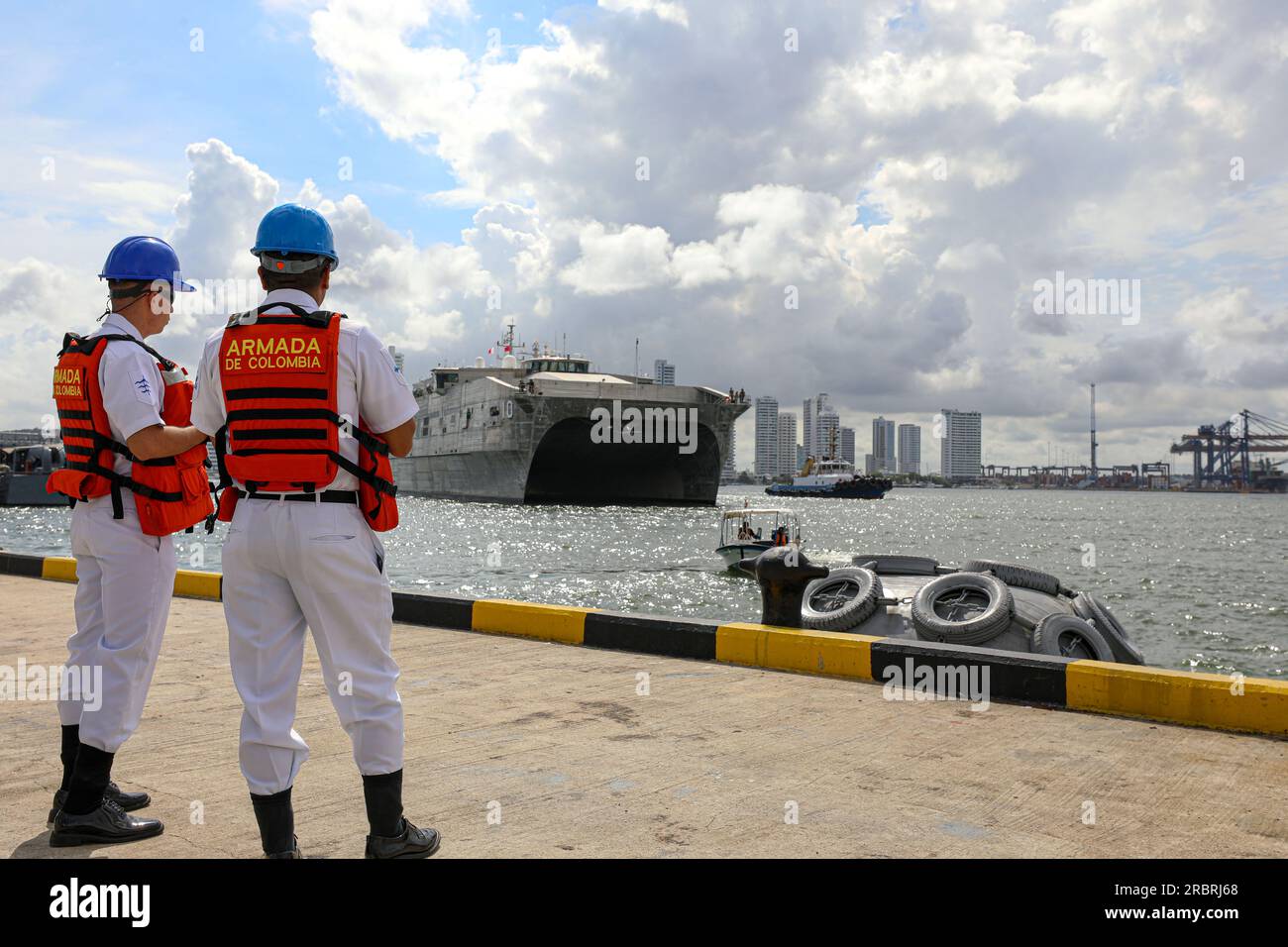 20230701-N-EA586-1012  CARTAGENA, Colombia (July 2, 2023) Colombian Navy Sailors observe as the expeditionary fast transport USNS Burlington (T-EFP 10) arrives at Colombian Base Naval Logistica ARC 'Bolivar', Colombia in preparation for UNITAS LXIV, July 2, 2023. Burlington is one of 26 vessels slated to participate in UNITAS LXIV, the world’s longest running maritime exercise, July 11-21. Colombia is hosting UNITAS LXIV this year with nearly 7,000 people from 20 nations. (U.S. Navy photo by Lt.j.g. Nicko West/Released) Stock Photo