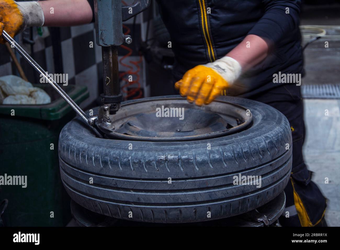 Unrecognizable man separating tire from rim Stock Photo
