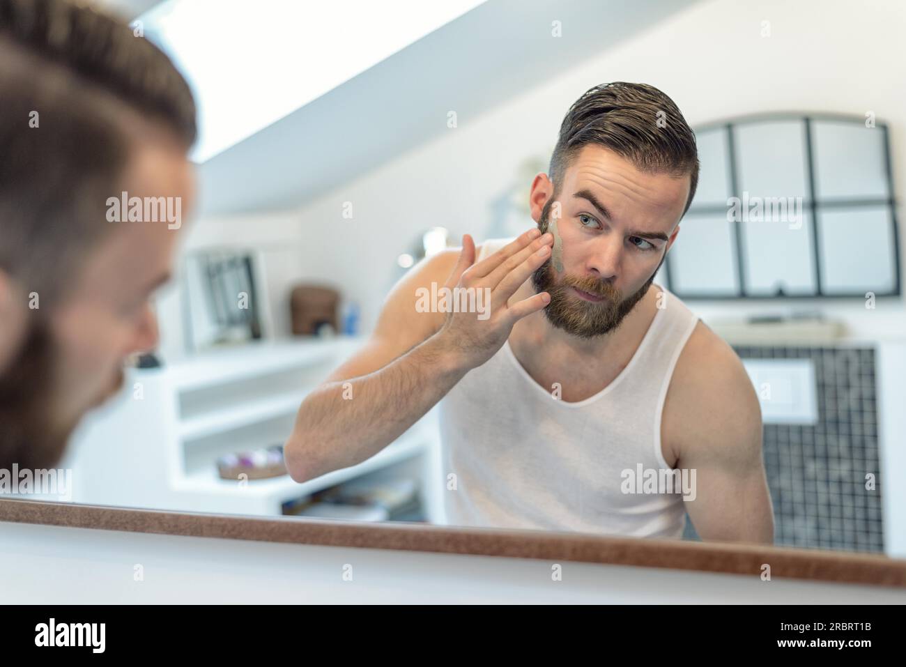 Young bearded man applying hi res stock photography and images Alamy