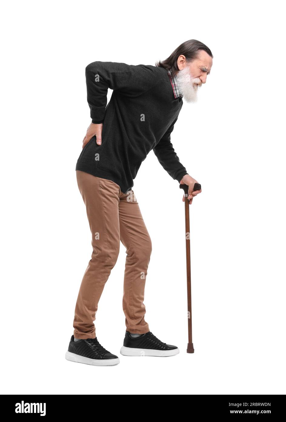 Senior man with walking cane suffering from back pain on white