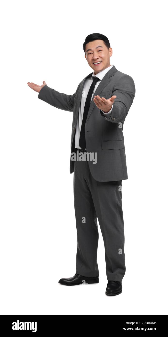 Businessman in suit posing on white background Stock Photo - Alamy
