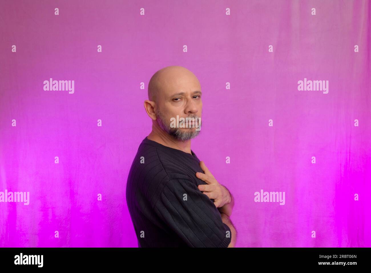 Portrait of a serious 50yearold man with a beard and bald head