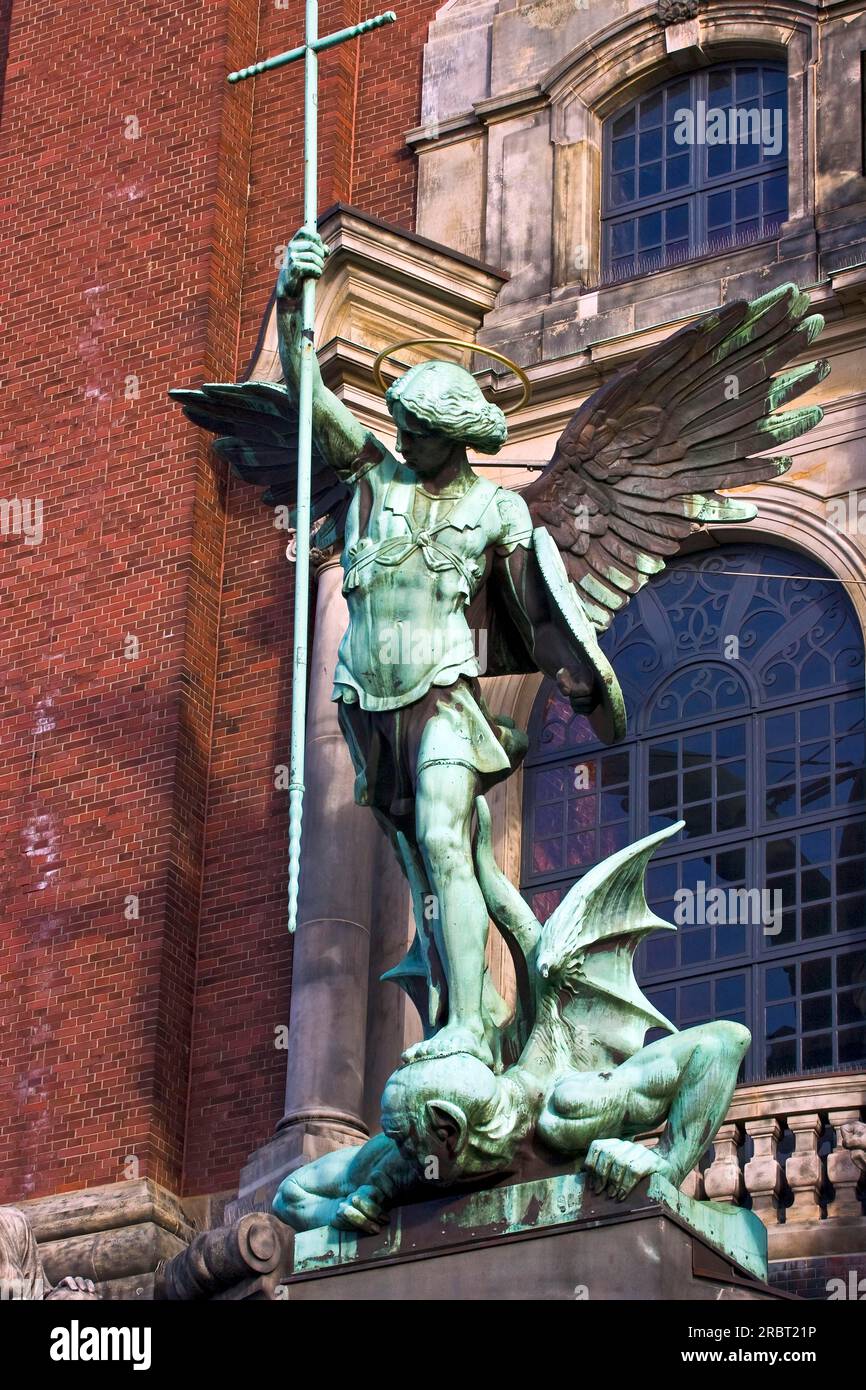 Sculpture Archangel Michael Defeats Satan, main portal of St. Michael's Church, Hamburg, Germany, Hamburg Michel Stock Photo