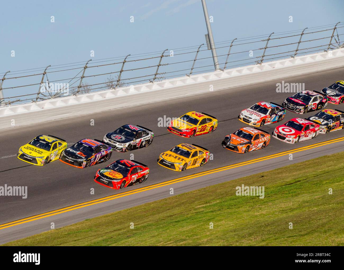 Daytona Beach, FL, Feb 21, 2016: Joe Gibbs Racing teammates, Matt Kenseth (20) and Denny Hamlin (11) touch on the last lap of Daytona 500 at the Stock Photo