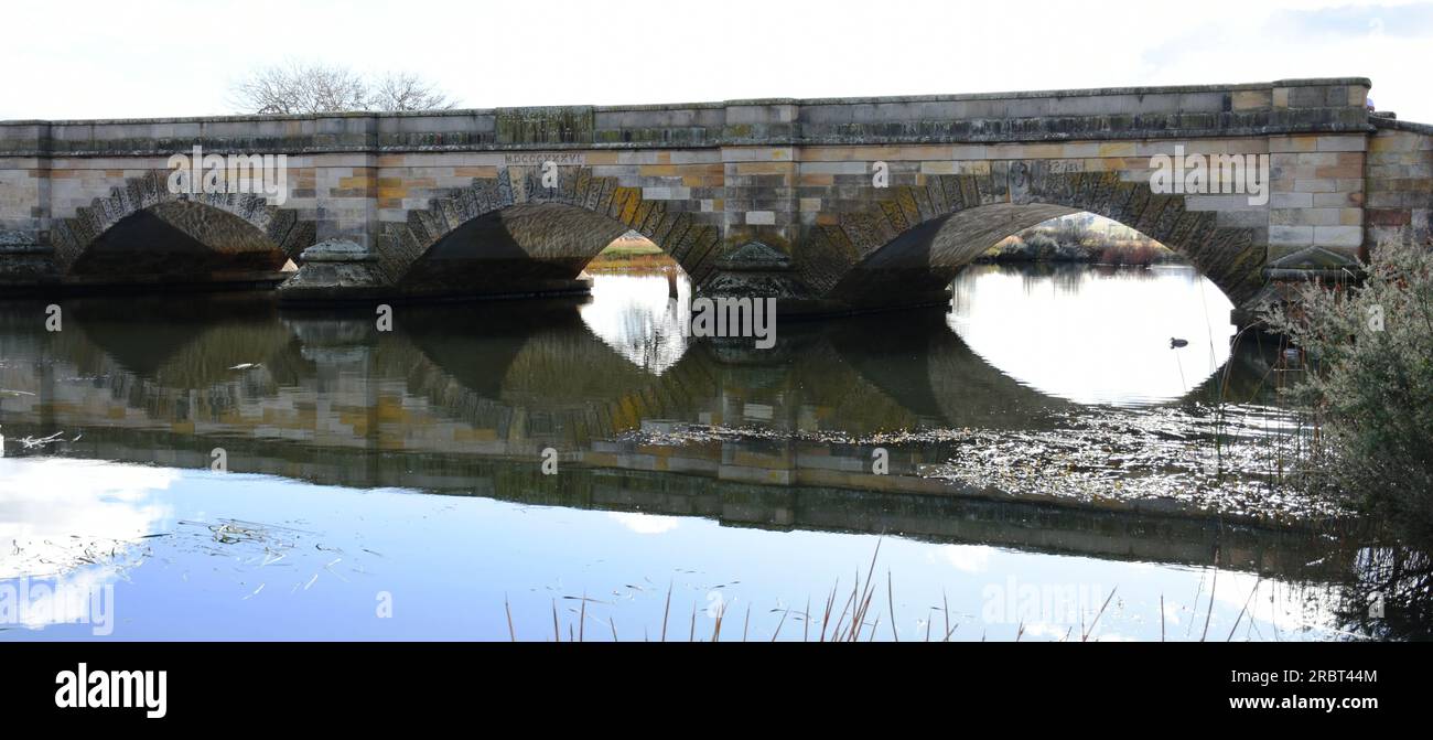 Bridge with arches and reflection on water Stock Photo - Alamy
