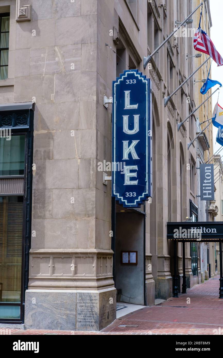 NEW ORLEANS, LA, USA JULY 9, 2023 Luke Restaurant next to the Hilton