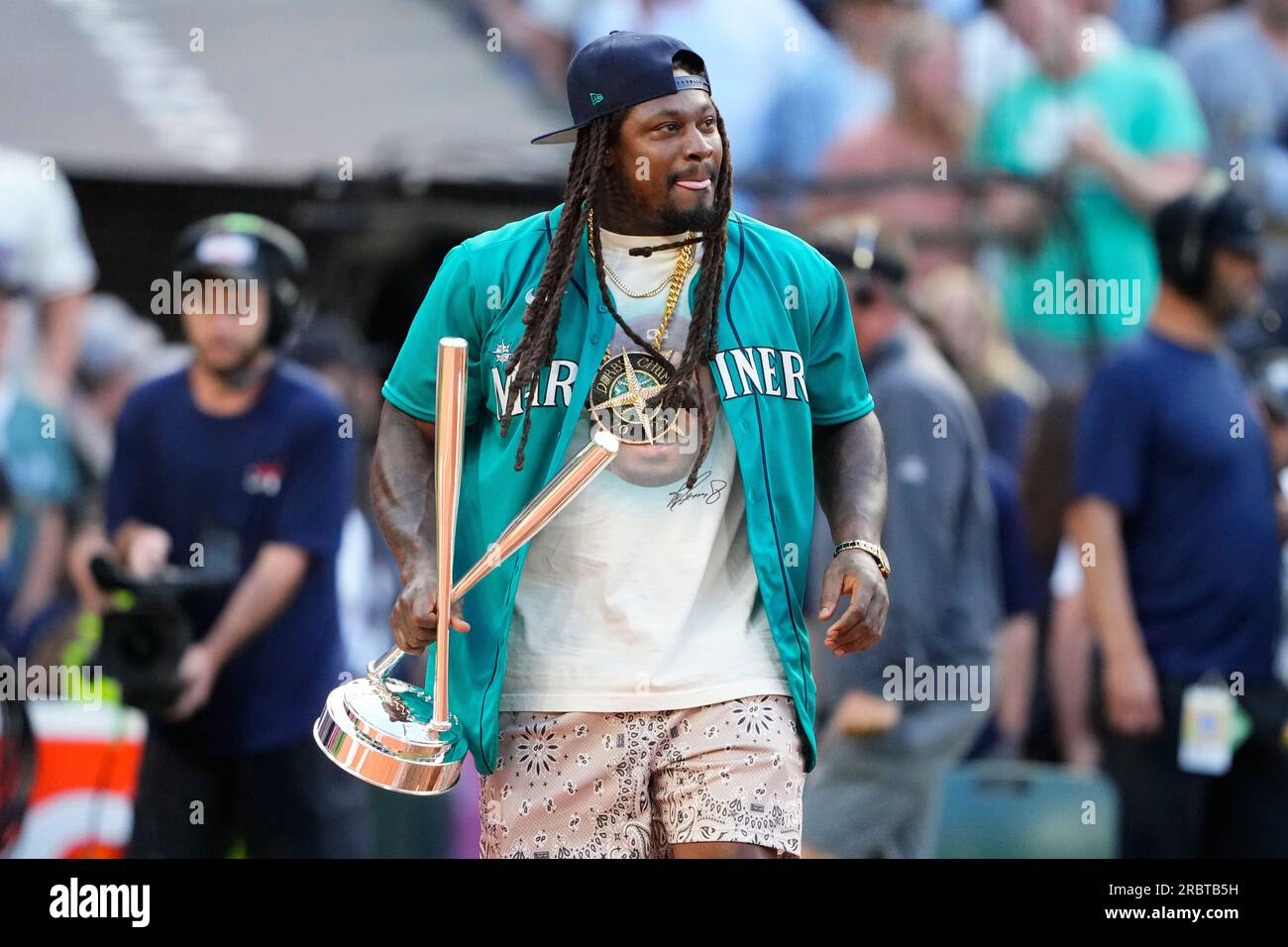 Former Seattle Seahawks running back Marshawn Lynch holds the