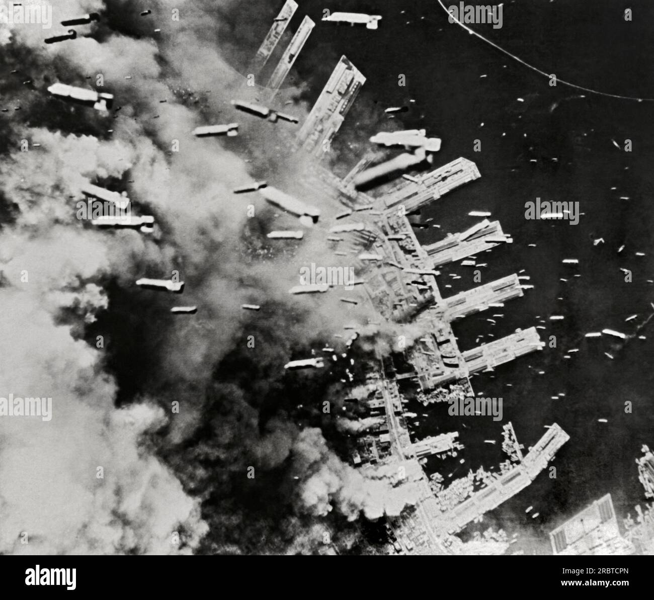 Kobe, Japan,  June, 1945 B-29 bombers dropping thousands of incendiary bombs upon the industrial city. Stock Photo