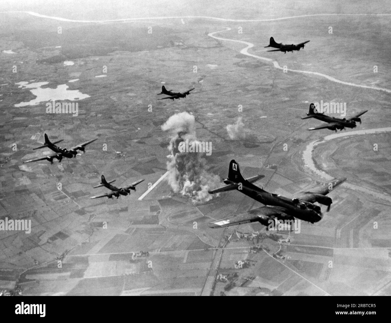 Marienburg, Germany,  October 22, 1943 Smoke rises from the bombed Focke-Wulf aircraft fighter plant as B-17 Flying Fortresses of the US 8th Air Force Bomber Command turn from their target on their way home from what is now Malbork, Poland. Stock Photo