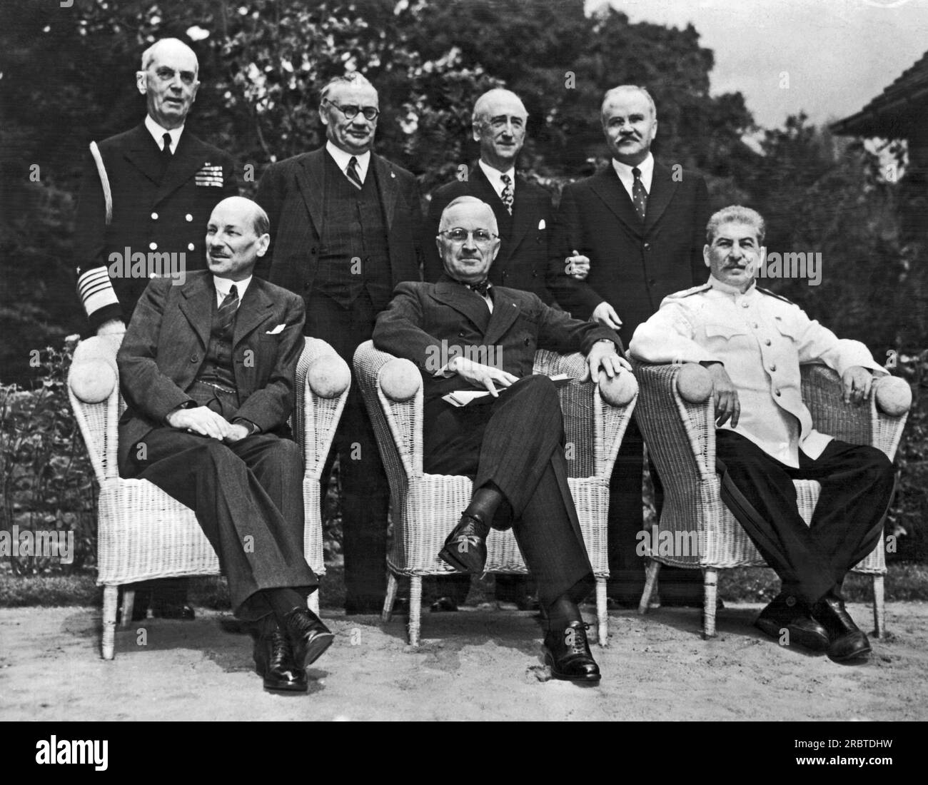 Potsdam, Germany:  August 10, 1945 The scene in the palace garden at Potsdam as the Big Three posed for photographers just before the final peace conference meeting. Seated left to right: Great Britain Prime Minister Clement Attlee, U.S. President Harry S. Truman, and Russian Marshal Josef Stalin. Standing left to right are: Admiral William Leahy, Chief of Staff to President Truman; Hon. Ernest Bevin, Brtain's Foreign Minister; U.S. Secretary of State James Byrnes; and Russia's Foreign Minister Vyacheslav Molotov. Stock Photo