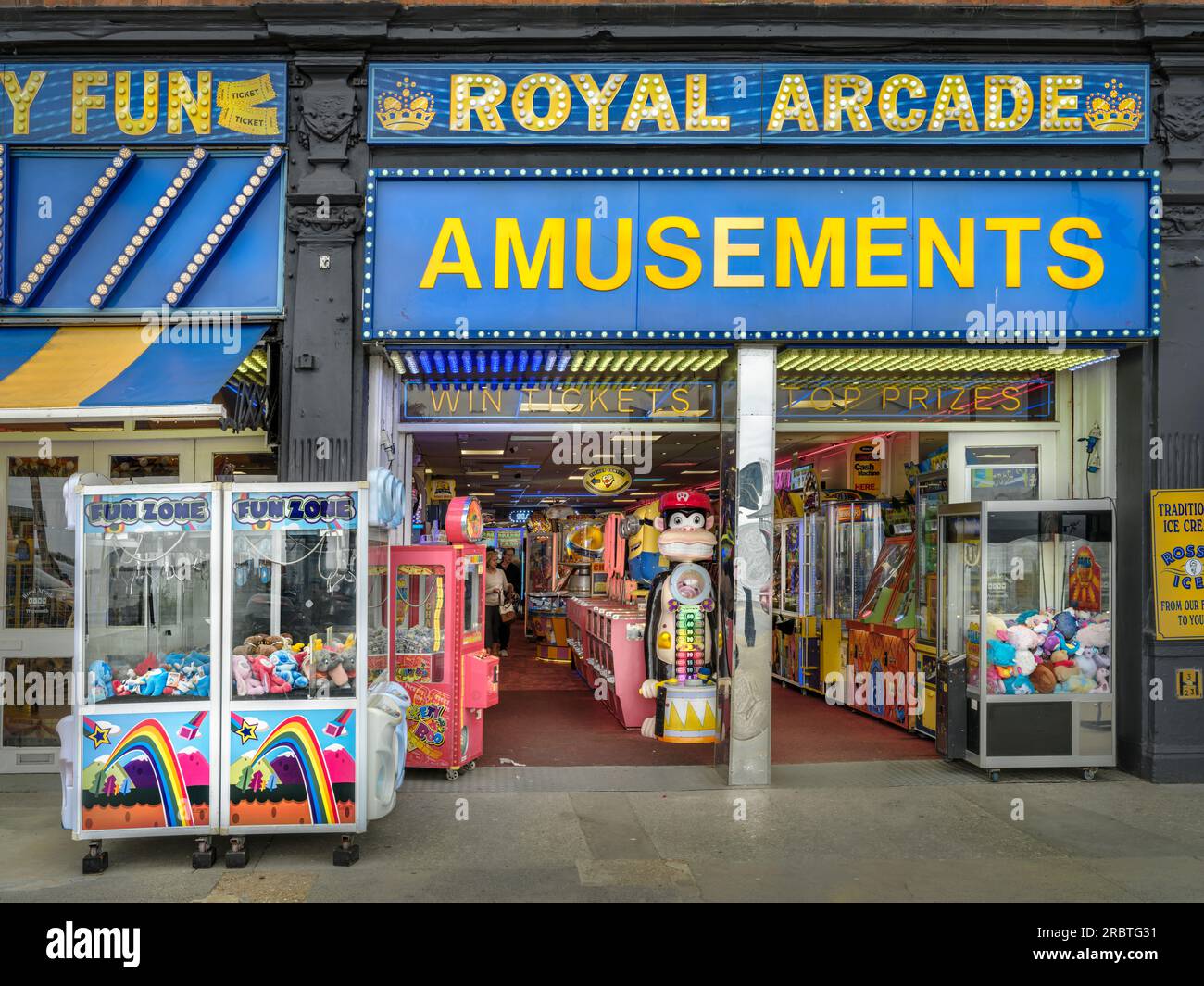 'Royal Arcade Amusements' on the seafront at Weymouth in Dorset, England. An amusement arcade, also known as a video arcade, or penny arcade, is a pla Stock Photo