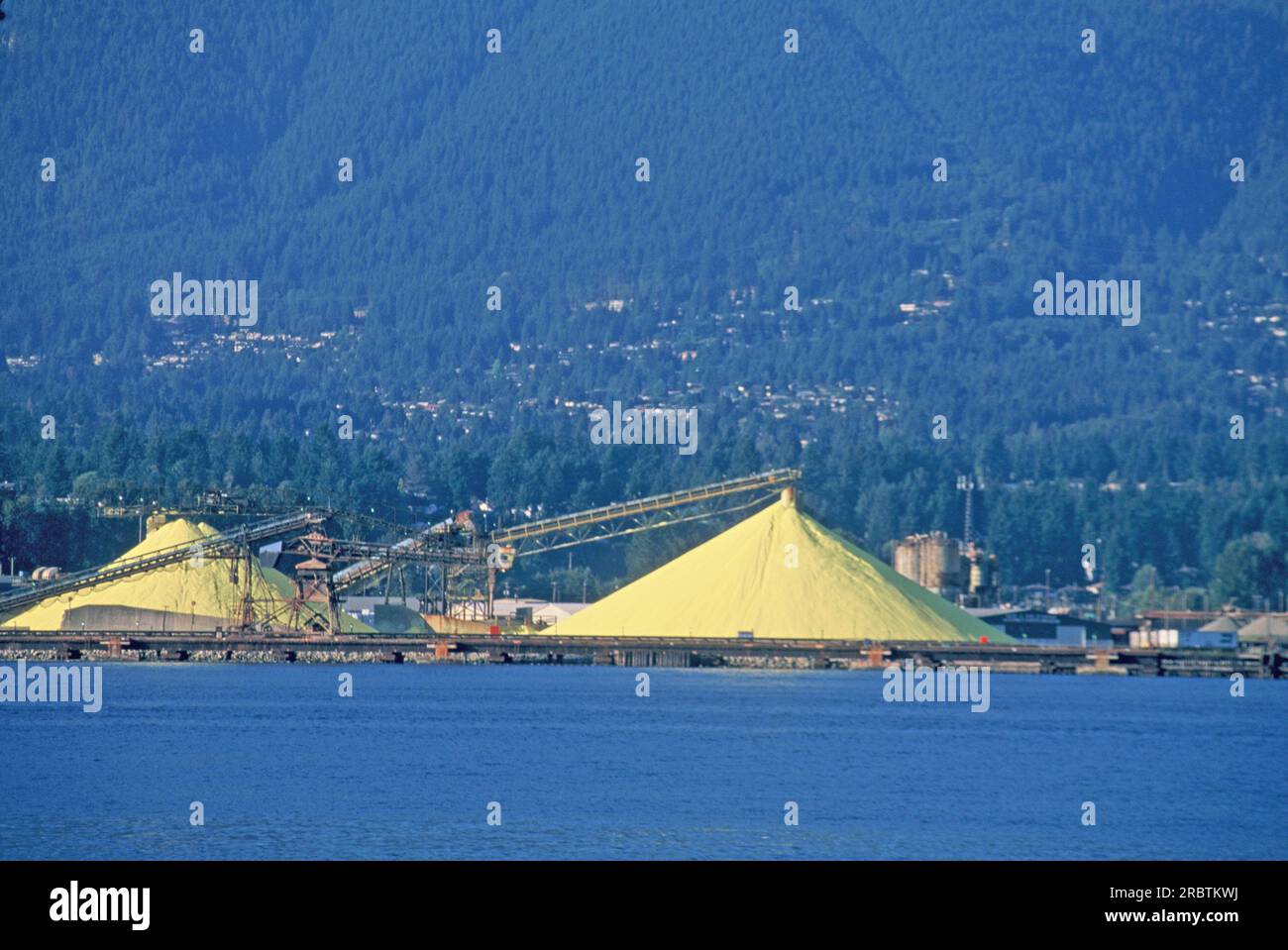 Yellow mountains of sulfur to be shipped out of Vancouver , Canada Stock Photo