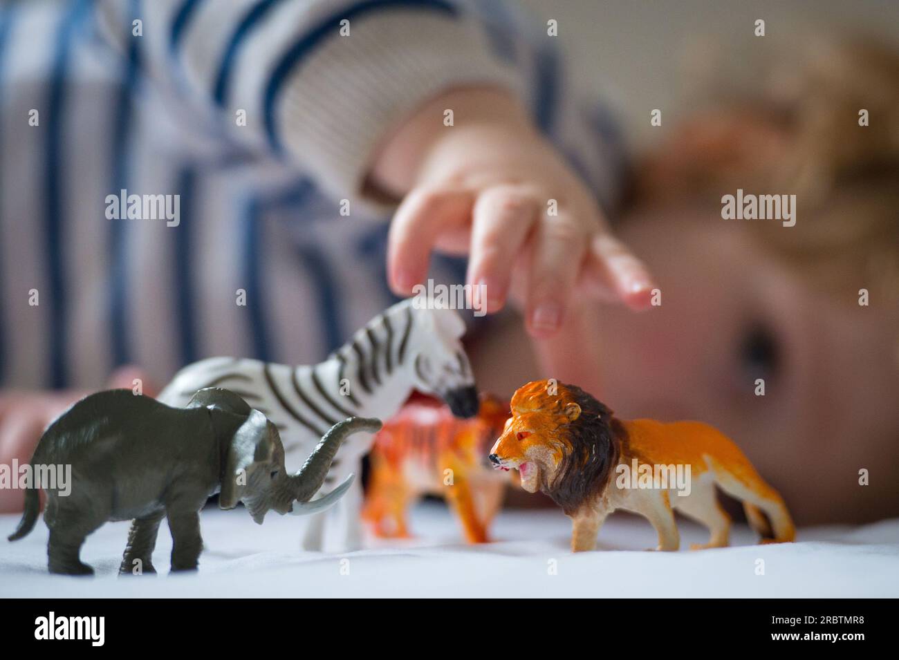 File photo dated 24/01/16 of a preschool age child playing with plastic toy animals. Tennis star Sir Andy Murray is among a host of celebrities supporting the charity UNICEF's demands to the Prime Minister for better early years support for children in the UK. Rishi Sunak has been urged to guarantee all babies and toddlers get the basic early help needed from maternity services to childhood education and care no matter where they live in the UK. Issue date: Monday July 10, 2023. Stock Photo