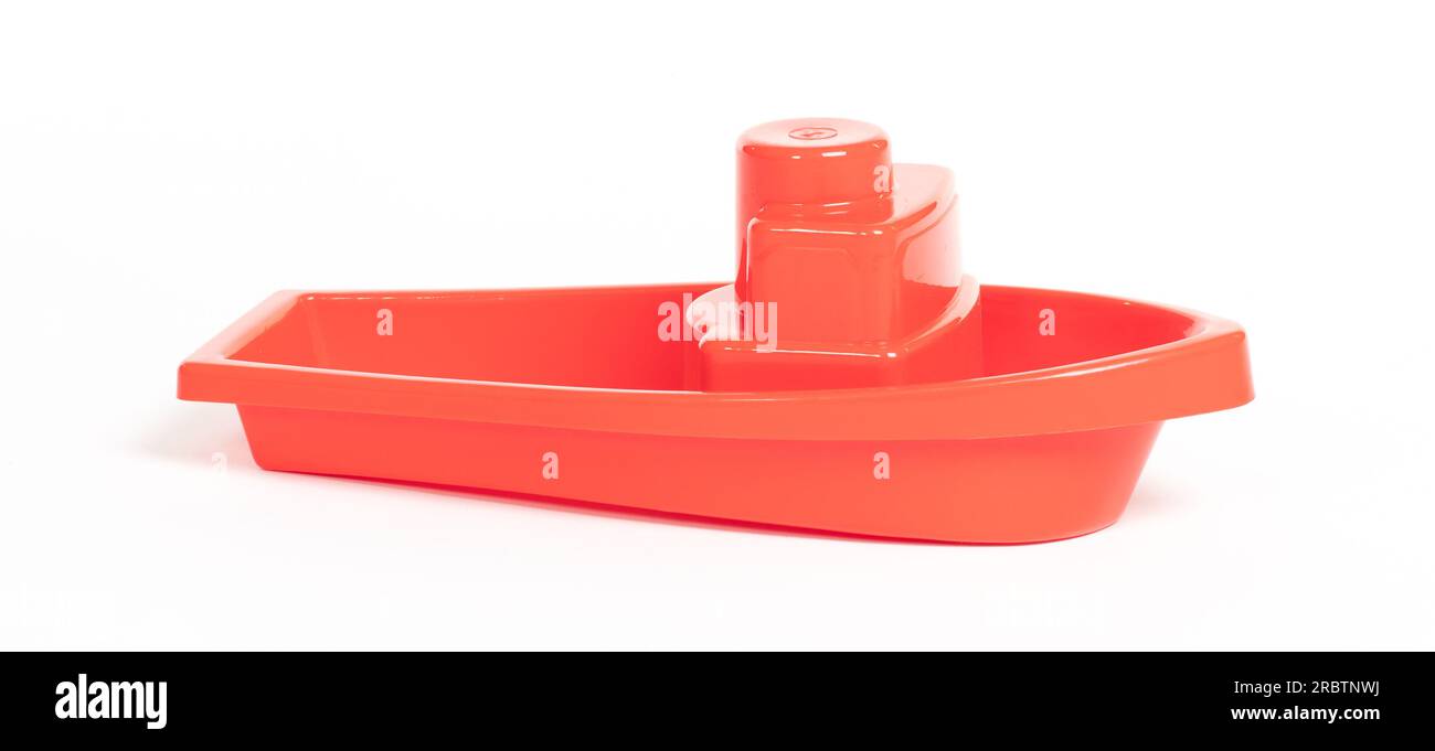 Plastic toy boat isolated on a white background Stock Photo - Alamy