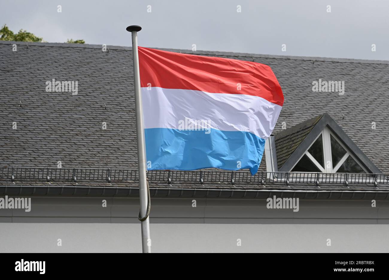 Marnach, Luxembourg. 28th May, 2023. The flag of Luxembourg flies in ...
