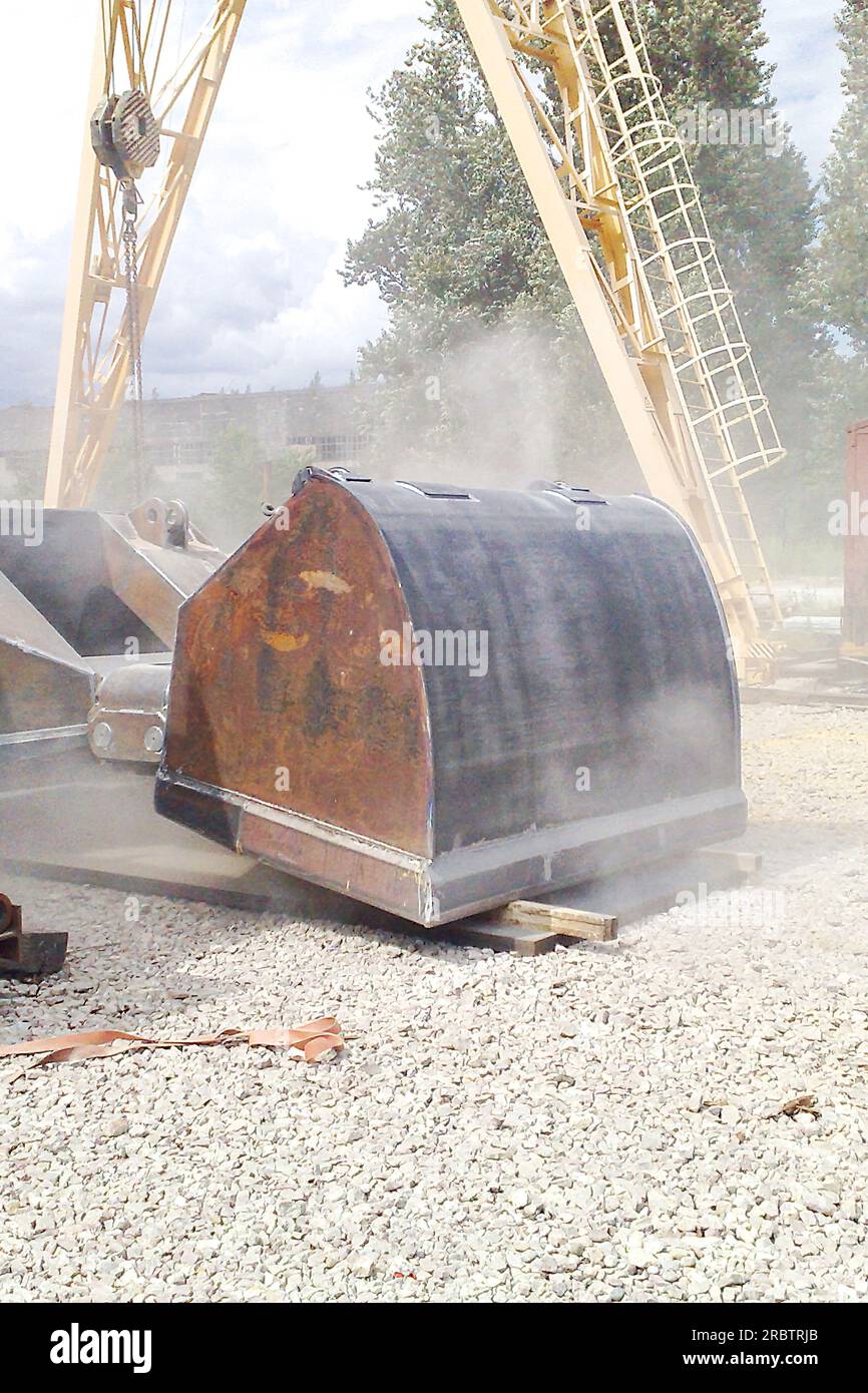 The metal construction surface before and after the sandblasting