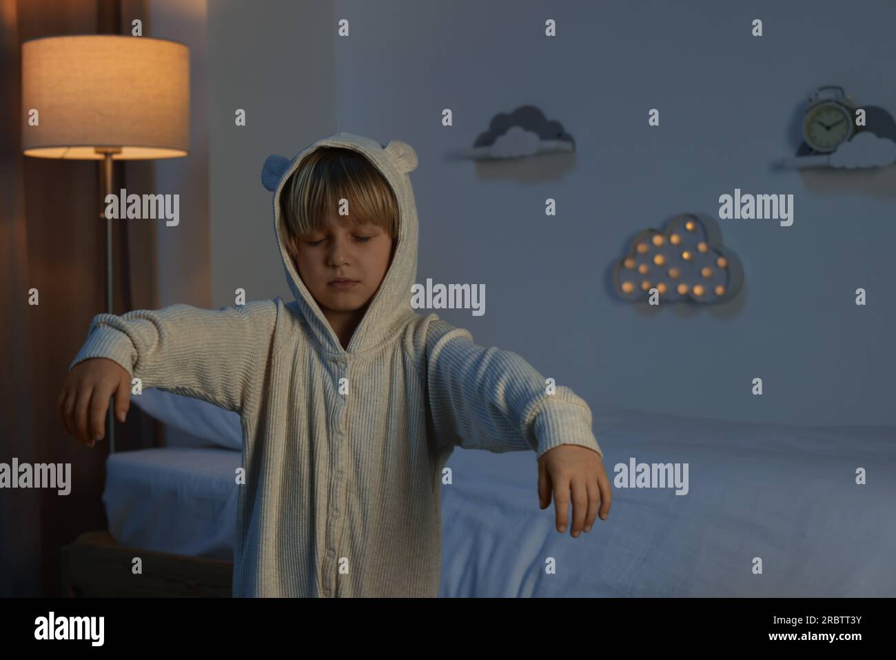 Boy in pajamas sleepwalking indoors at night Stock Photo Alamy
