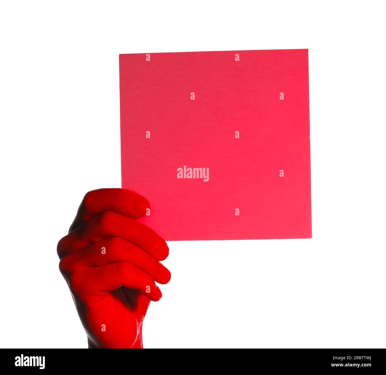 Man holding red sheet of paper on white background, closeup. Mockup for