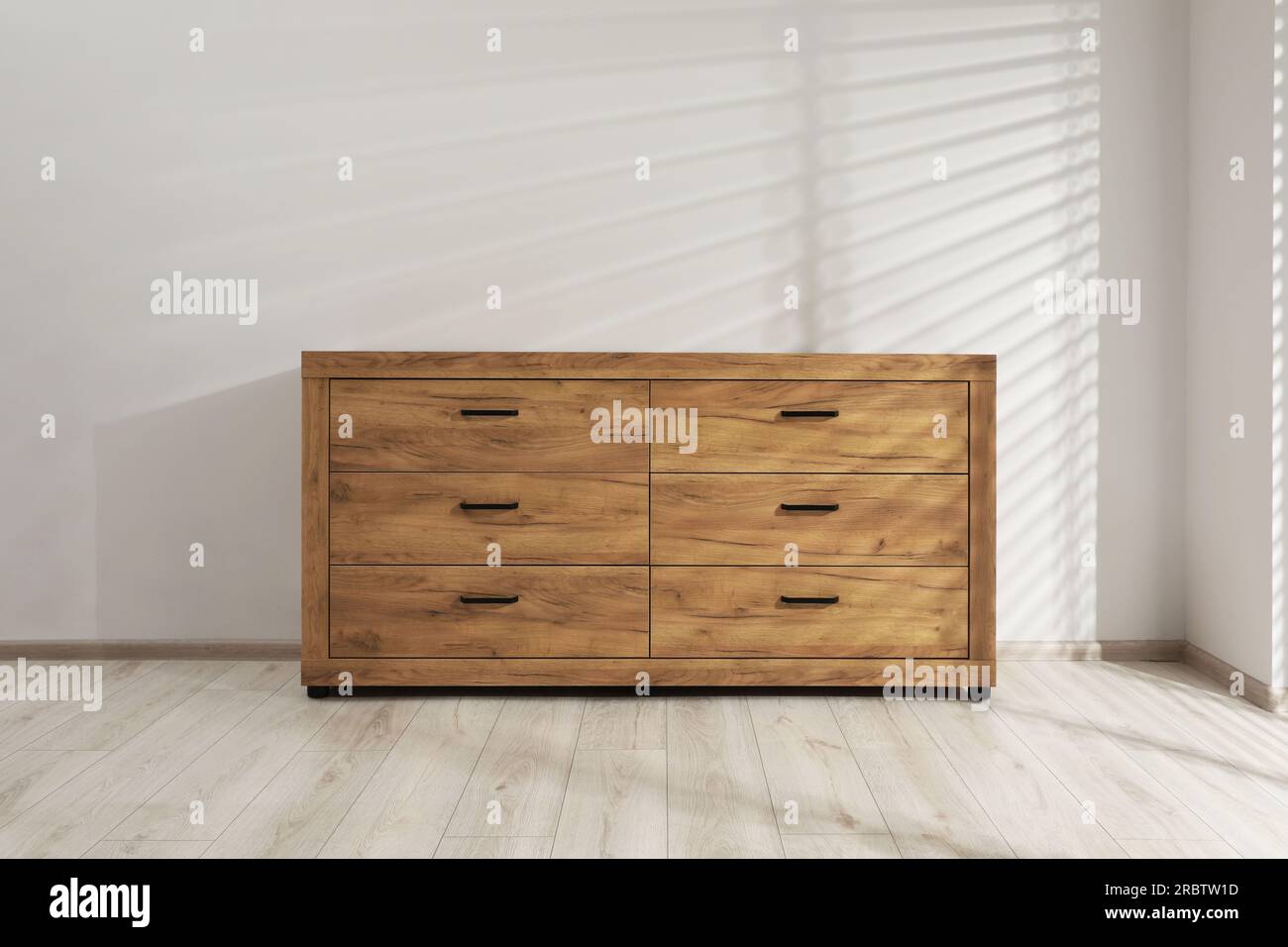 Wooden Stylish Chest Of Drawers Near White Wall Indoors Stock Photo Alamy wooden-stylish-chest-of-drawers-near-white-wall-indoors-stock-photo-alamy