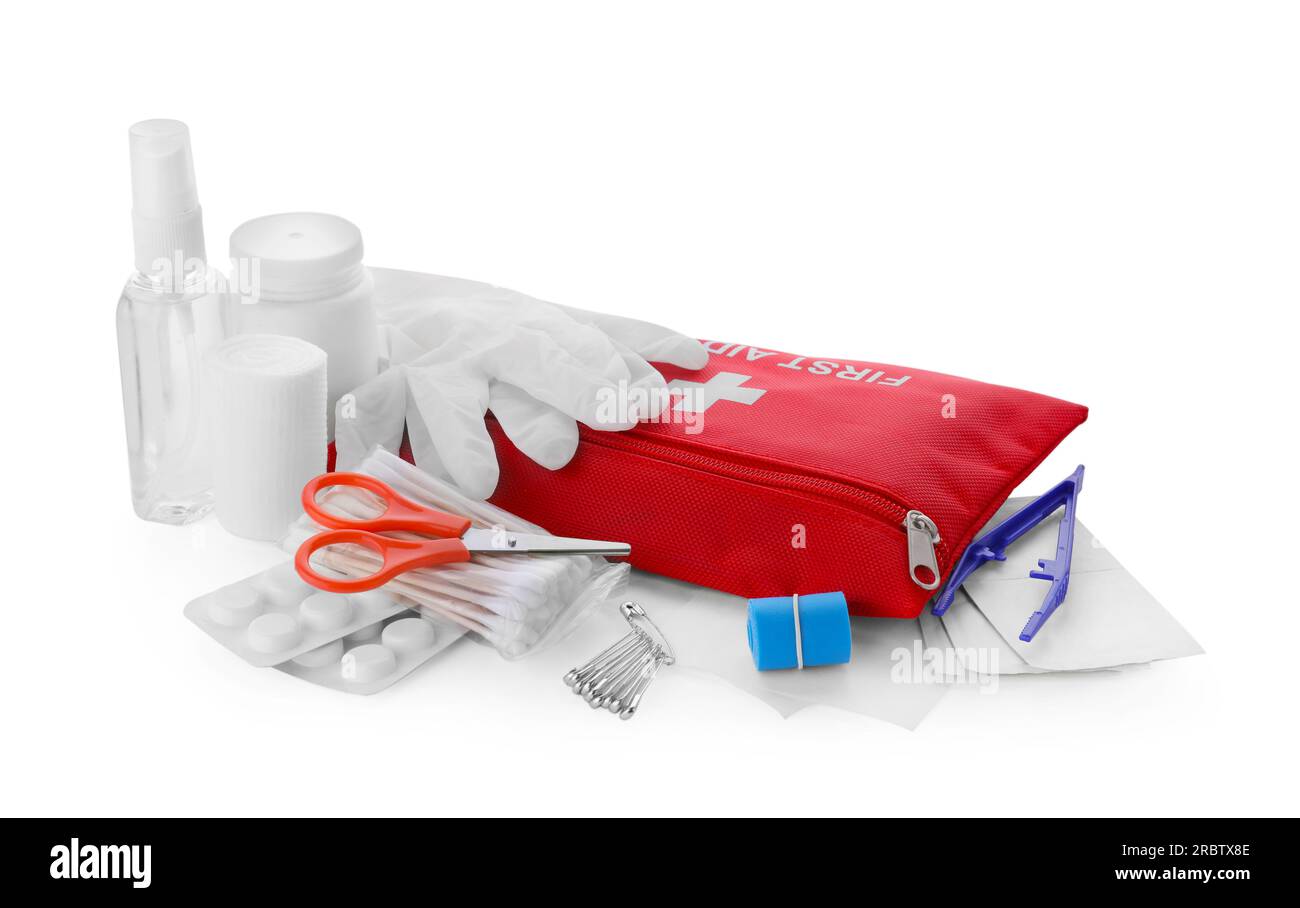 Red first aid kit, scissors, pins, gloves, cotton buds, pills, hand ...