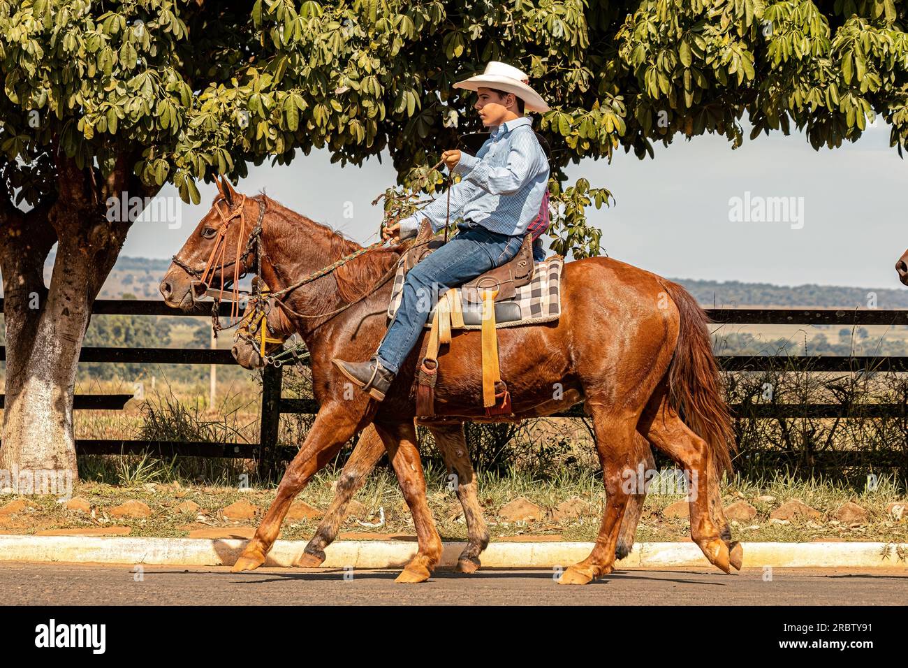 Apore, Goias, Brazil - 05 07 2023: Horseback riding event open to the public on public roads in the Brazilian city of Apore Stock Photo