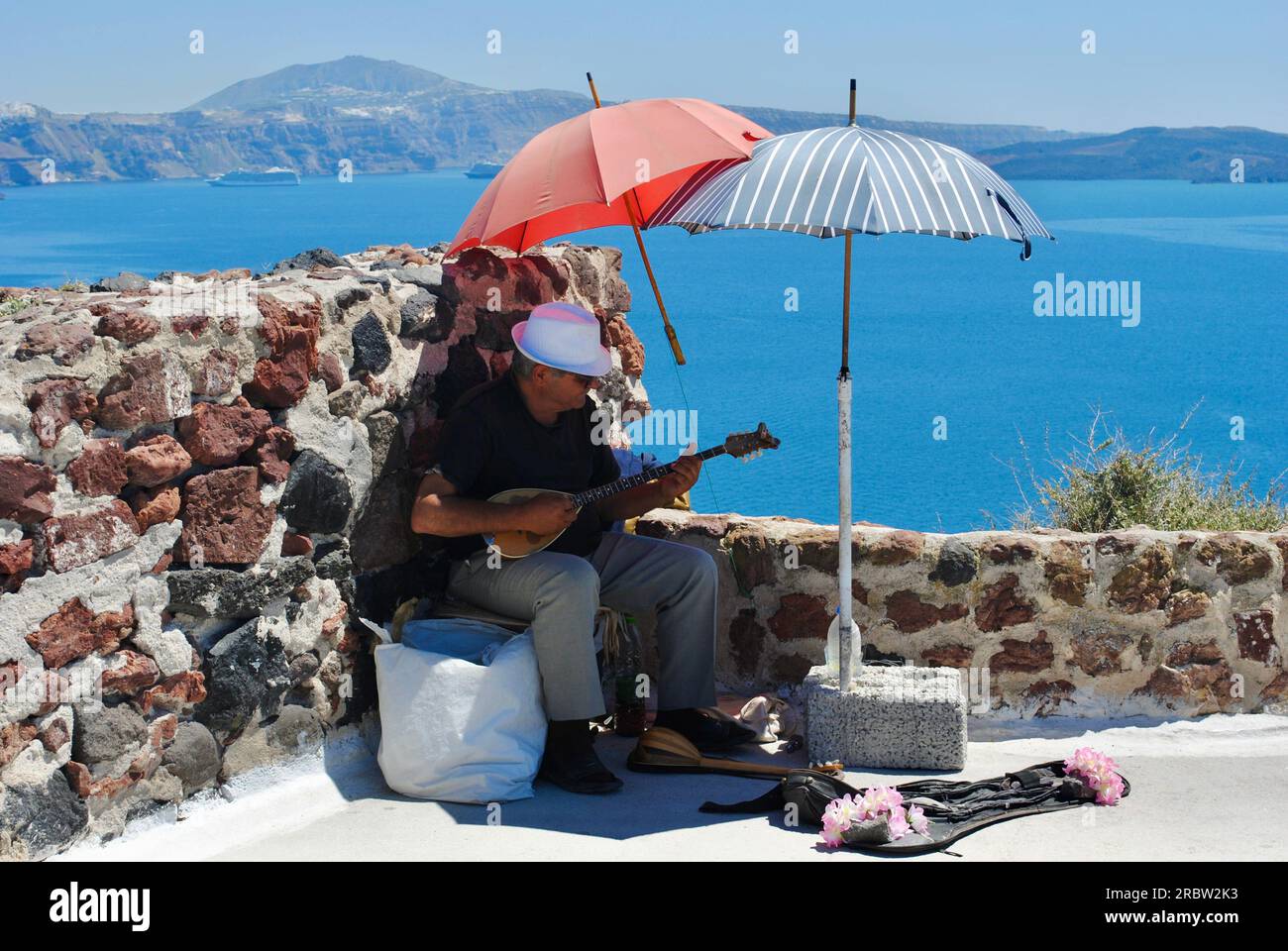 A man plays a bouzouki in Santorini, Greece Stock Photo Alamy