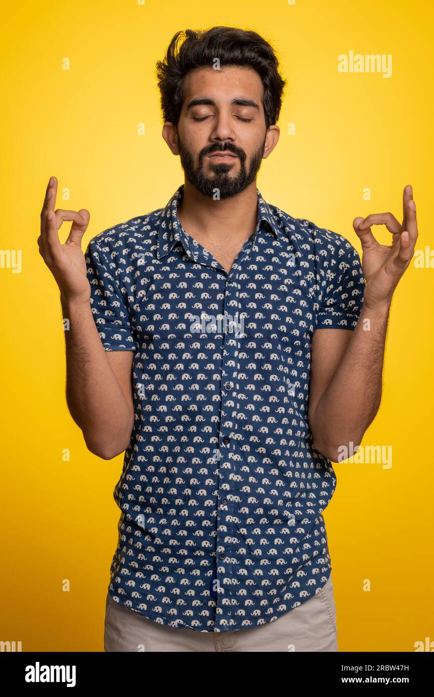 Indian guy closed eyes studio hi-res stock photography and images 