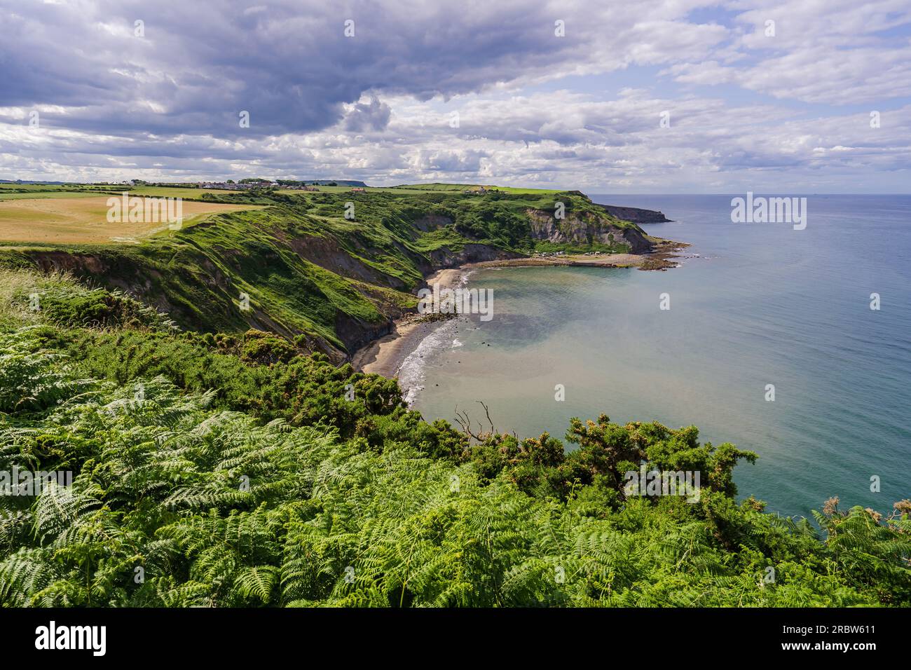 Clifftop view of Port Mulgrave. This photo was taken from the path between Port Mulgrave and Runswick Bay on the Cleveland Way in North Yorkshire. Stock Photo