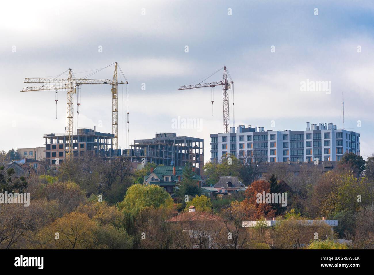 Building cranes against blue sky. tower cranes , Concept new building, realestate, housing