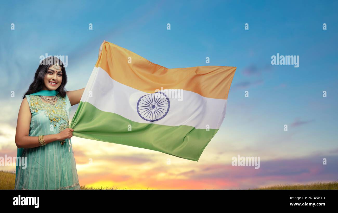 Indian woman holding Indian flag. India Independence Day concept Stock Photo