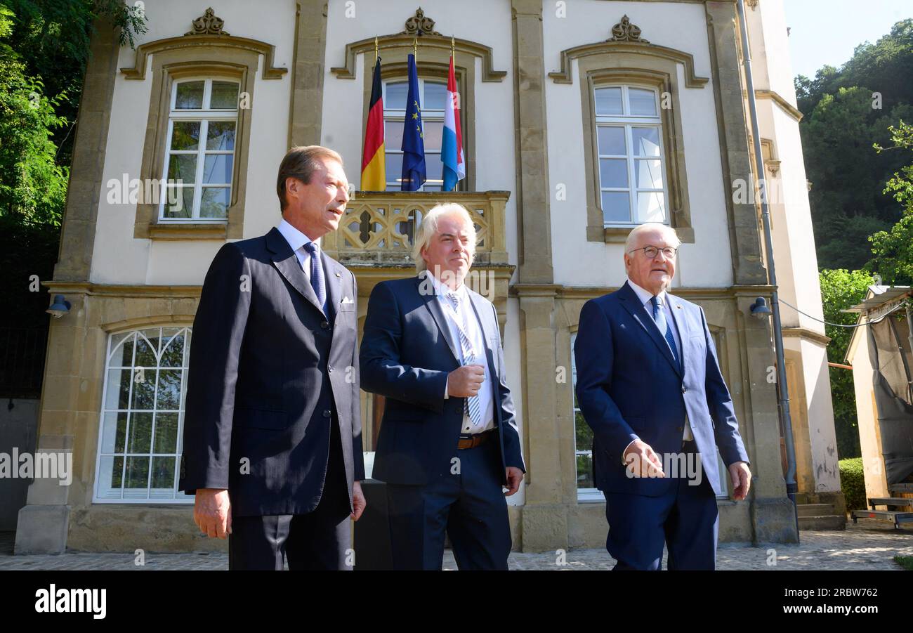 Luxemburg, Luxembourg. 11th July, 2023. German President Frank-Walter Steinmeier (r) and Grand Duke Henri of Luxembourg (l) visit Robert Schuman's birthplace together and are guided through the garden there by Andreas Fickers (m), director of the Luxembourg Center for Contemporary and Digital History. President Steinmeier and his wife are in Luxembourg for a two-day official visit. Schuman was French prime minister. Credit: Bernd von Jutrczenka/dpa/Alamy Live News Stock Photo