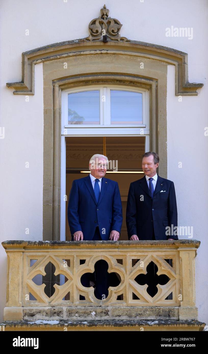 Luxemburg, Luxembourg. 11th July, 2023. German President Frank-Walter Steinmeier (l) and Grand Duke Henri of Luxembourg visit Robert Schuman's birthplace together and stand on the balcony there. President Steinmeier and his wife are in Luxembourg for a two-day official visit. Schuman was French prime minister. Credit: Bernd von Jutrczenka/dpa/Alamy Live News Stock Photo