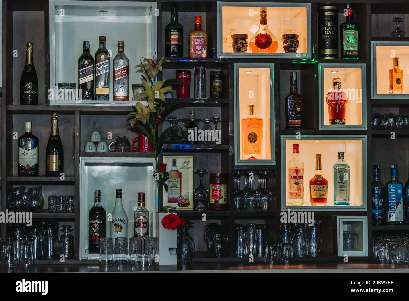 Alcohol Bottles On Restaurant Bar with nice lighting on Shelves. Modern ...