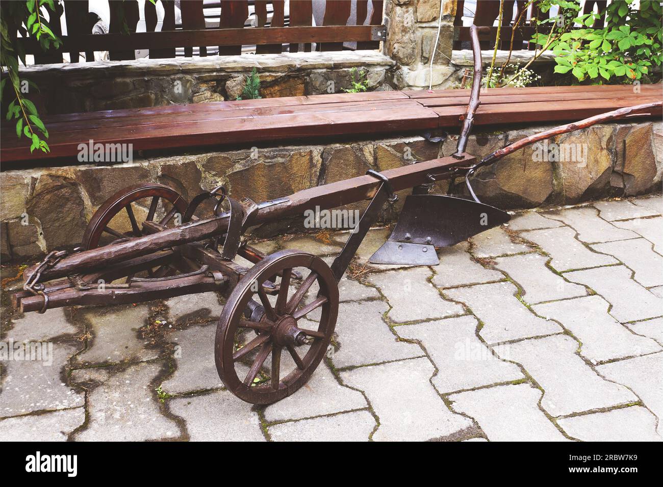 Antiquarian plow. Old wooden plow. Soil tillage vintage concept Stock