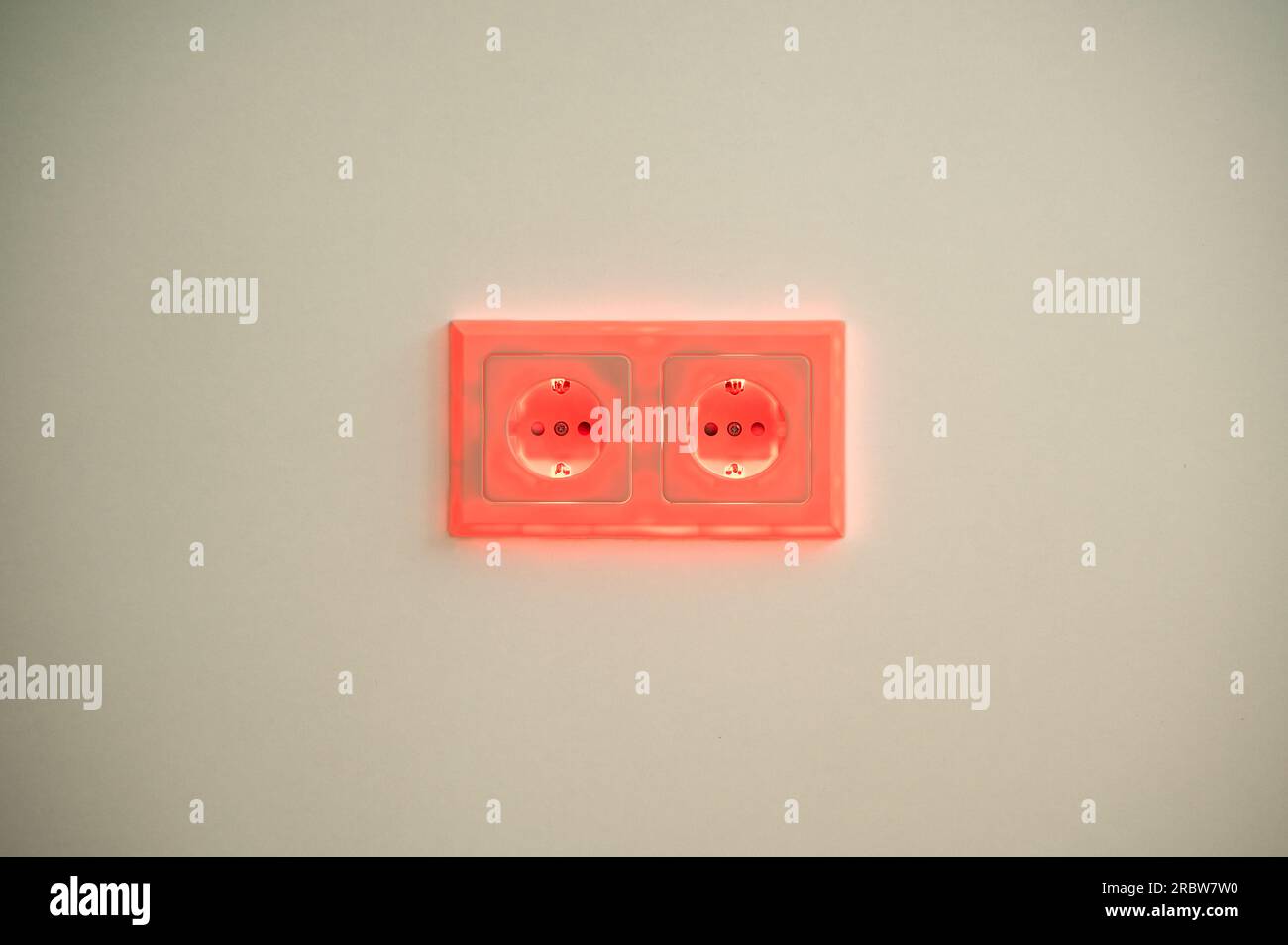 Red illuminated socket to symbolise power consumption and electrical